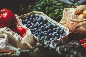No plastic concept. Blueberry, chard, pepper, onion in cotton bag and paper box. Zero waste concept. Eco friendly concept.