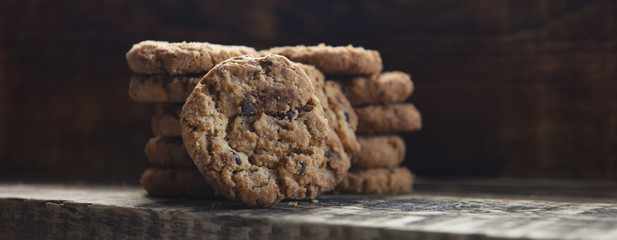 Fototapeta premium traditional chocolate chip cookies on wooden boards
