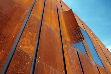 Detail of a building facade made of rusted metal blocks. Abstract architecture. Minimalistic design. - Powered by Adobe