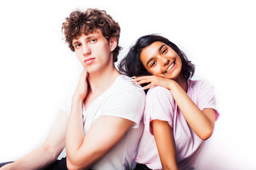 best friends teenage girl and boy together having fun, posing emotional on white background, couple happy smiling, lifestyle people concept, blond and brunette multi nations closeup