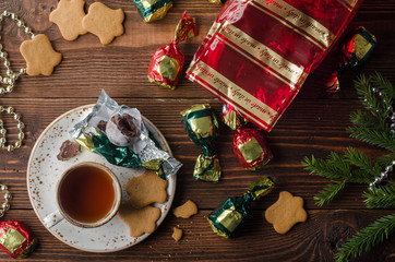 flatlay with cup of tea, sweets, cookies, christmas tree