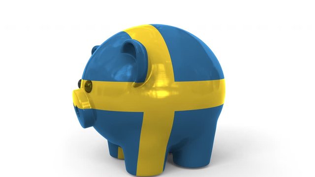 Coins fall into piggy bank painted with flag of Sweden. National banking system or savings related conceptual 3D animation