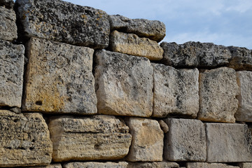 walls of the ancient ruins of limestone blocks. Ruins of the city of Hierapolis, Turkey.