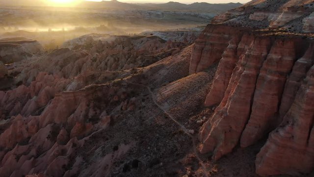 Aerial view of Red Valley and Rose Valley at sunset in Cappadocia, Turkey