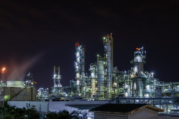 Fototapeta na wymiar Manufacturing of petroleum industrial plant,Gas distillation column at night