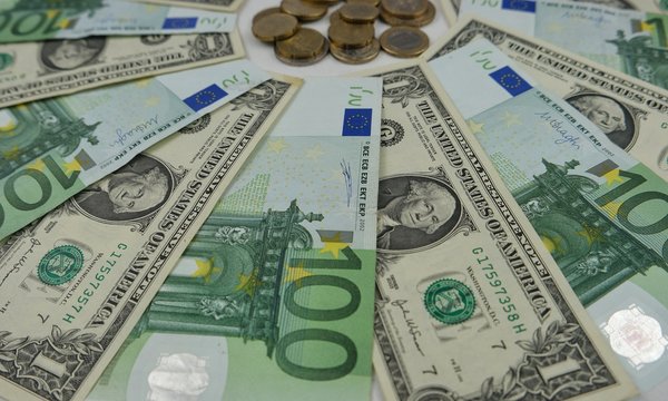 Banknotes of 100 euros and 1 dollar, paper money and coins, background