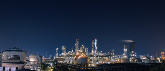 Panorama of Oil and gas refinery plant or petrochemical industry at night sky, Manufacturing of...