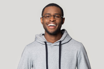 Head shot portrait laughing African American man in glasses