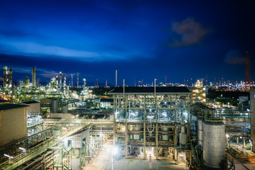 Petrochemical plant on twilight sky background, Manufacturing of chemical industrial plant, Glitter...