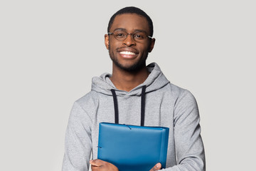 Head shot portrait smiling African American man holding folder