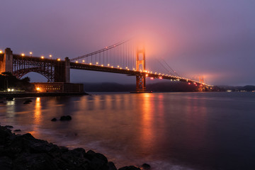 The Golden Gate Bridge Side View From San Francisco With Fog And Light Reflections