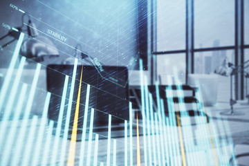Forex graph hologram with desktop office computer background. Double exposure. Concept of financial...