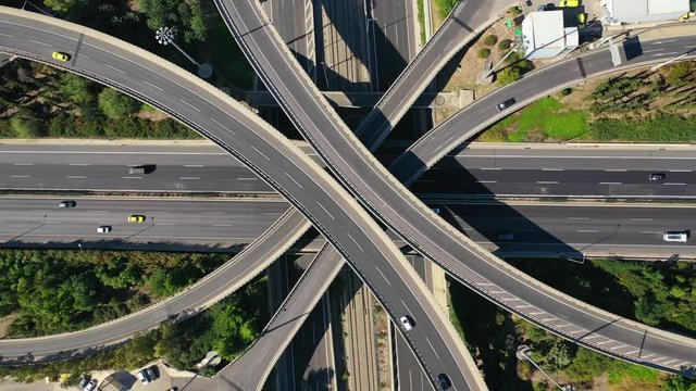 Aerial drone video of urban multilevel highway junction with light traffic
