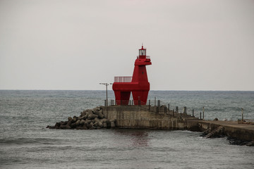 Iho Lighthouse at Iho Tewoo beach in the North of Jeju, South Korea