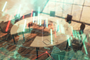 Fototapeta premium Double exposure of stock market graph with globe hologram on conference room background. Concept of international finance