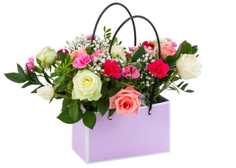 Gift box with beautiful flowers isolated on white background