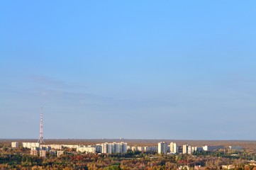 Telecommunication tower with cellular network antenna on city background