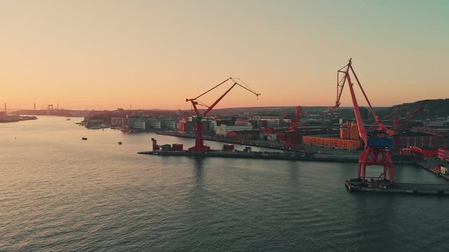 Aerial over the Gota alv river in Gothenburg at dusk. Drone slow forward dolly