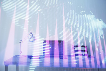 Stock market chart with globe hologram and desktop office computer background. Multi exposure....