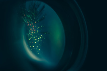 Close up beautiful  optical sight aim with reflection in glass on a darkness background. Macro View.