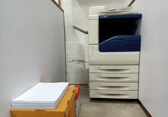 Large format printer with paper on the side