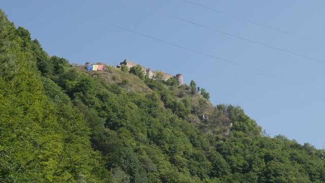 Vlad Tepes Dracula Poenari castle on top of the hill 4K tilting video
