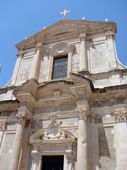 The bottom view of the amazing medieval art is reflected in ancient Catholic temples and churches on a clear sunny day.