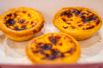 egg tart sweet custard cream on paper box very sweet and delicious     