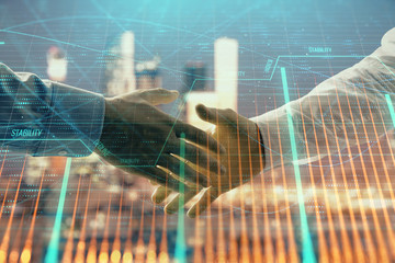 Double exposure of financial chart on cityscape background with two businessmen handshake. Concept of financial analysis and investment opportunities