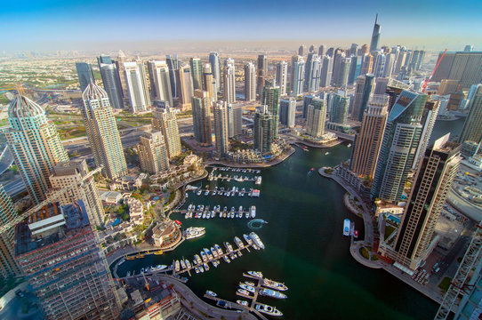 View on Dubai Marina skyscrapers and the most luxury superyacht marina. Dubai, United Arab Emirates.