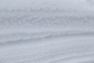 Snow texture. Closeup of icy snow texture