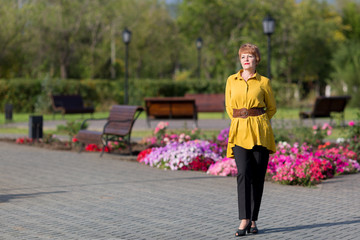 Woman senior citizen sunny weather outdoors, sunny day Adult short-haired woman best portrait,