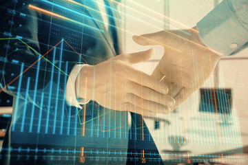 Plakat Multi exposure of financial graph on office background with two businessmen handshake. Concept of success in business