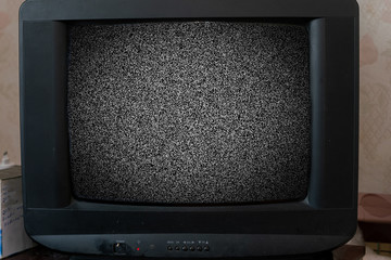 old vintage tv with noise texture at home