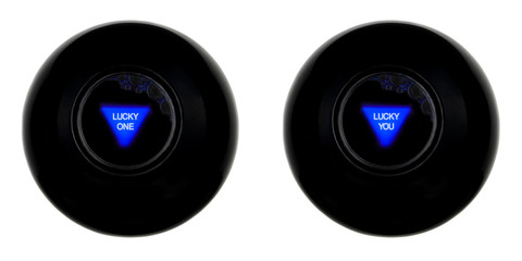 Set of two black magic 8 balls with predictions LUCKY ONE and LUCKY YOU isolated on white background