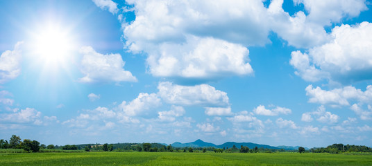 Beautiful blue sky with white clouds and sun
