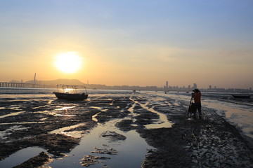 Fototapeta premium under sunset sea, scenes from hong kong to shenzhen coast at Ha Pak Nai, Yuen Long