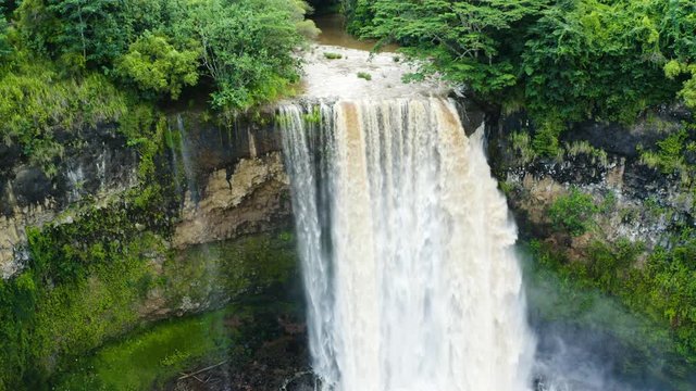 4K footage of gaint waterfall with birds flying close above the falls.