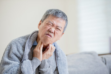 elderly man has sore throat