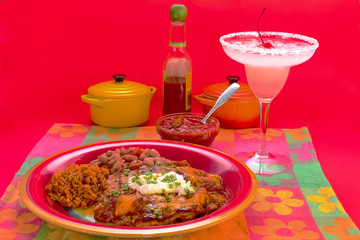 Mexican Enchilada Dinner with Margarita in colorful Mexican Restaurant setting.