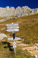 Dolomites Alps. Rotwand. Trekking direction indicators in focus in the foreground. The background...