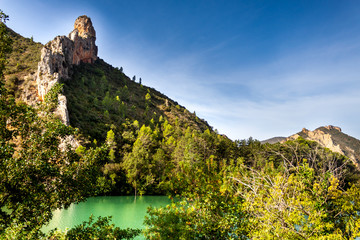 Nice and peaceful view of the lake with a rocky mountains blackground. Sant LLorenç swamp. Catalonia.  Segre river.