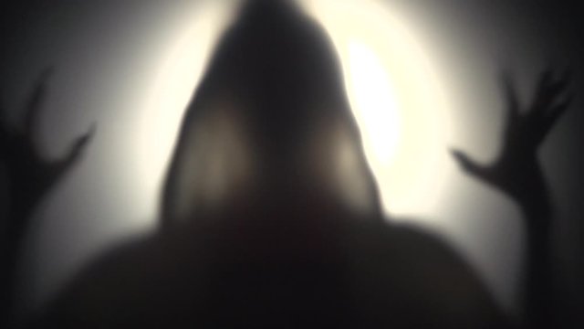 silhouette mystical creepy creature on black background