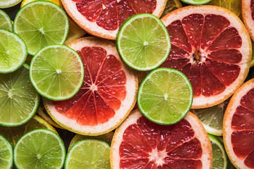 Slices of pink Star Ruby grapefruit and green lime