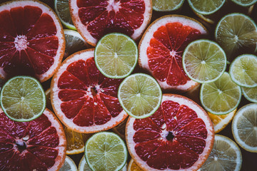 Slices of pink Star Ruby grapefruit and green lime