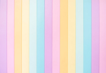 Colorful wooden background. Top view texture of colorful wooden background in pastel rainbow color (purple, pink, orange yellow, light blue and aqua blue)