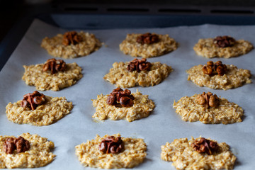 Cooking Homemade Oatmeal Cookies with Walnuts