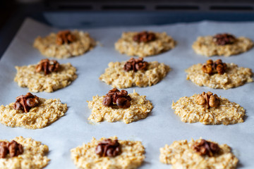 Cooking Homemade Oatmeal Cookies with Walnuts