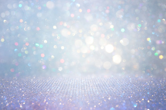 abstract glitter silver, gold , blue lights background. de-focused