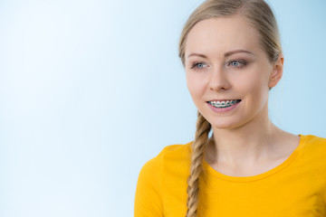 Woman showing her teeth with braces